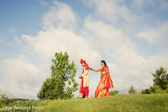 Indian bride and groom first look in a field. indian bride and groom,wedding ceremony fashion,first look