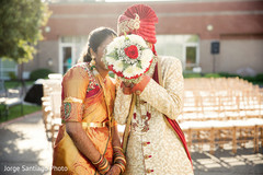 Cutest Indian couple's wedding portrait. indian bride and groom,bridal bouquet,indian wedding photography