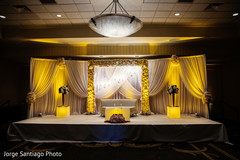 Yellow and white Indian wedding stage. indian wedding reception photography,floral and decor,uplightning