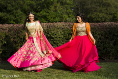 Lovely bride and family showing their lenghas pink lengha,bright pink lengha