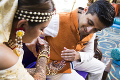Indian groom checking out mehndi bridal mehndi,mehndi designs