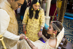 Indian bride with her parents indian bride fashion,yellow sari,indian bride hair accessories