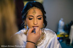 Indian bride makeup session. bridal jewelry,hair and makeup,getting ready