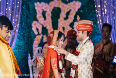 Sweet flower garland exchange ritual. indian bride and groom,indian wedding ceremony,flower garlands