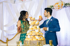 Unique wedding cake cutting. indian wedding reception,donut wedding cake,indian bride and groom
