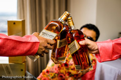 Indian groomsmen getting ready with whiskey bottles. Indian groomsmen getting ready with whiskey bottles.