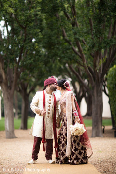 Indian lovebirds kissing outdoor wedding photography,indian wedding fashion
