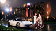 Indian newlyweds with their sport getaway car transportation,indian wedding transportation,indian newlyweds