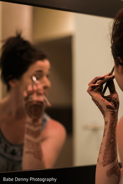Lovely Indian bride doing her own makeup. bridal mehndi,getting ready,hair and makeup