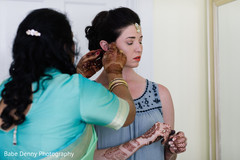 Indian bride preparing her wedding look. bridal mehndi,getting ready,hair and makeup