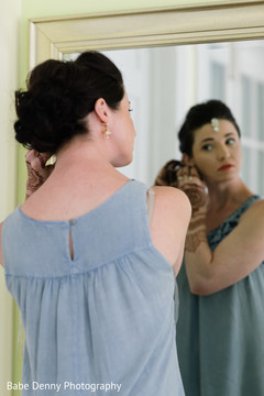 Indian bride final touch ups. bridal mehndi,getting ready,hair and makeup