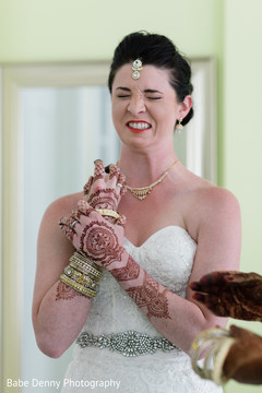 Indian bride candid shot. getting ready,white wedding dress,bridal fashion,bridal mehndi