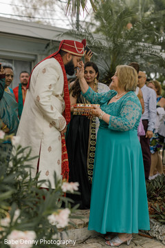 Indian groom welcome ritual. baraat,pre-wedding ritual,indian groom fashion