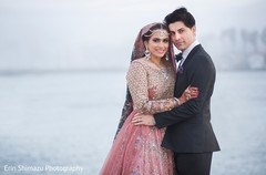 Indian wedding photo by the ocean pink lengha,suit,indian groom fashion