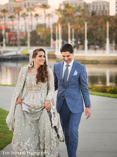Happy indian couple ready for their photo shoot bridal lengha,silver lengha
