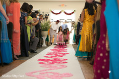 Indian flower girls entering the wedding ceremony. zoroastrian wedding,floral an decor,flower girls