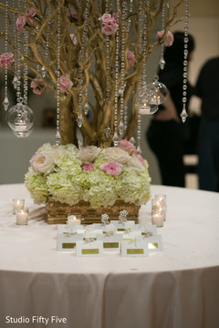 Festooned seating card table. indian wedding reception,floral and decor,seating cards,table plan decor