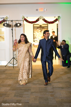 Indian bride parents' big entrance. indian wedding reception,planning and design
