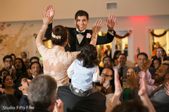 Jubilant Indian wedding celebration. indian wedding reception,dj,indian bride and groom