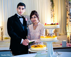 Indian wedding cake cutting scene. indian wedding reception,indian wedding cake,indian bride and groom