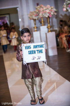 Ring bearer boy. indian wedding ceremony,floral and decor,ring bearer boy