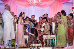 Sweet Indian couple at their wedding ceremony. indian wedding ceremony,floral and decor,indian bride and groom,mandap