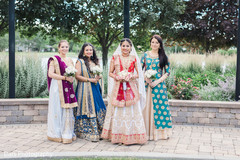 Dazzling indian bride posing with bridesmaids indian bride fashion,indian bridesmaids’ fashion,indian bridal bouquet