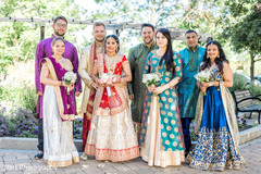 indian bride and groom posing with bridesmaids and groomsmen indian groom fashion,indian bride fashion,indian groomsmen fashion,indian bridesmaids’ fashion