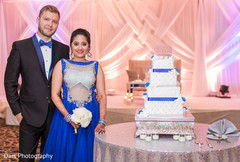 Indian bride and groom's wedding cake indian groom fashion,indian bride fashion,indian wedding reception,indian wedding cake