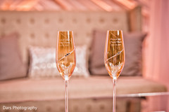 Indian bride and groom's decorated champagne glasses indian wedding reception,indian wedding planning and design