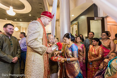 Indian groom during milni ritual indian groom fashion,indian wedding ceremony,milni ceremony
