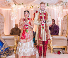 Charming indian bride and groom during wedding ceremony indian wedding ceremony,indian groom fashion,indian bride fashion