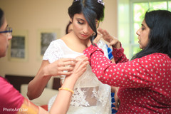 Indian bride's sari draping. indian bride,sari draping,getting ready