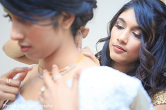 Indian bride's final touch ups. indian bride,getting ready,white sari,hair and makeup