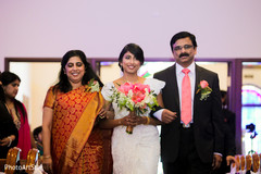 Indian bride walking down the aisle. indian wedding ceremony,indian wedding decor,indian bride,bridal bouquet