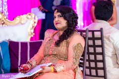 Indian bride and groom playing games during sangeet game Indian bride and groom playing games during sangeet game