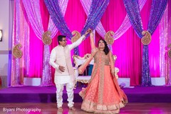 Traditional indian couple's performance pre- wedding celebrations,sangeet,indian bride and groom