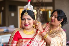 Lovely indian bride getting ready indian bride hair and makeup,indian bride getting ready,bridal jewelry