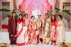 Indian bride and groom's portrait with family indian wedding ceremony,indian bride and groom portrait