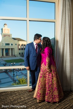 Indian bride and groom's intimate moment indian wedding reception,indian bride fashion,indian groom suit