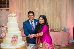 Indian wedding reception cutting the cake scene indian wedding reception,indian bride and groom,indian wedding cake topper,indian wedding cake