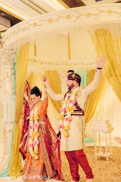 Happy Indian newly wedded couple. indian fusion wedding ceremony,indian bride and groom,mandap