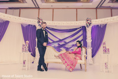 Indian couple posing during the wedding celebration. indian wedding photography,indian bride and groom,reception fashion