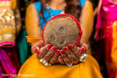 Indian bride's holding coconut close up pre- wedding celebrations,indian bride,mehndi art