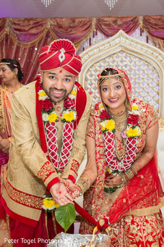 Indian bride and groom making offerings to sacred fire indian wedding ceremony,indian bride and groom,indian wedding ceremony photography