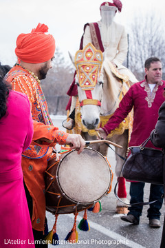Indian groom's procession with dhol player indian wedding baraat,baraat horse,indian groom,dhol player