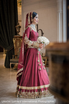 Gorgeous indian bride looking out the window indian bride lengha,indian bridal bouquet,bridal jewelry