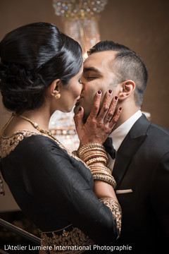 Sweet indian couple kissing indian groom suit,indian bride fashion,indian wedding gallery