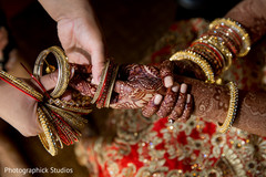 Indian bride putting bridal bangles on Indian bride putting bridal bangles on