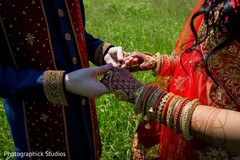 Indian bride and groom holding hands close up first look photography,indian groom fashion,indian bride fashion,bridal bangles